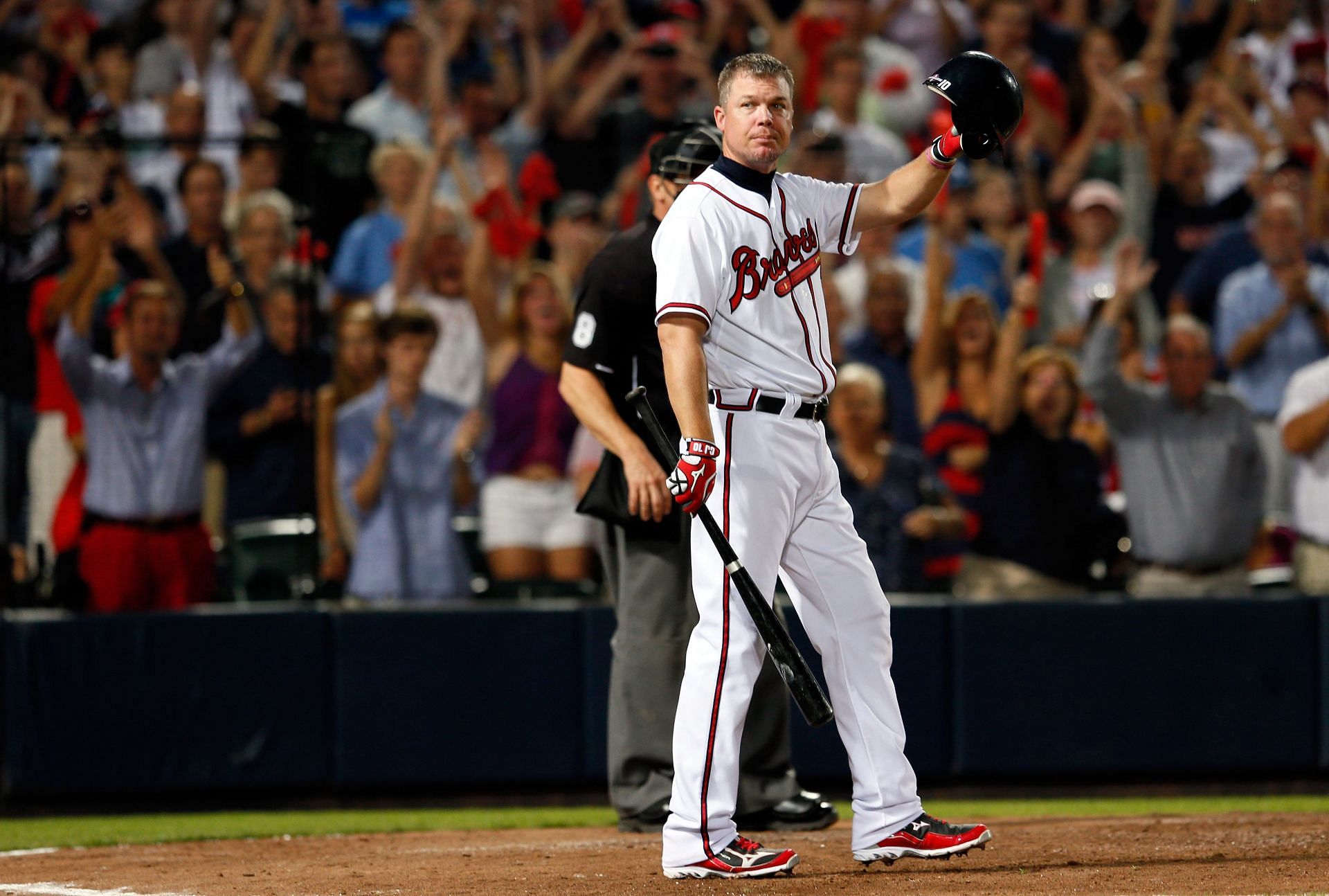 Chipper Jones of the Atlanta Braves tips his helmet to the crowd before his final at bat before the Braves lose to the St. Louis Cardinals 6-3 during the National League Wild Card playoff game at Turner Field on October 5, 2012, in Atlanta, Georgia.
